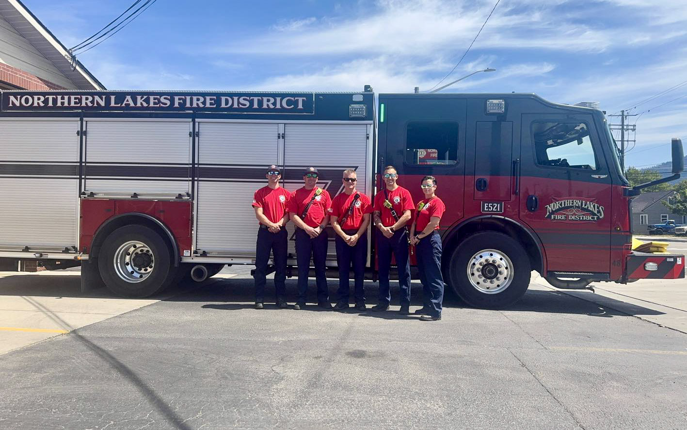 Meridian Fire Department standing in front of fire truck in Coeur d' Alene