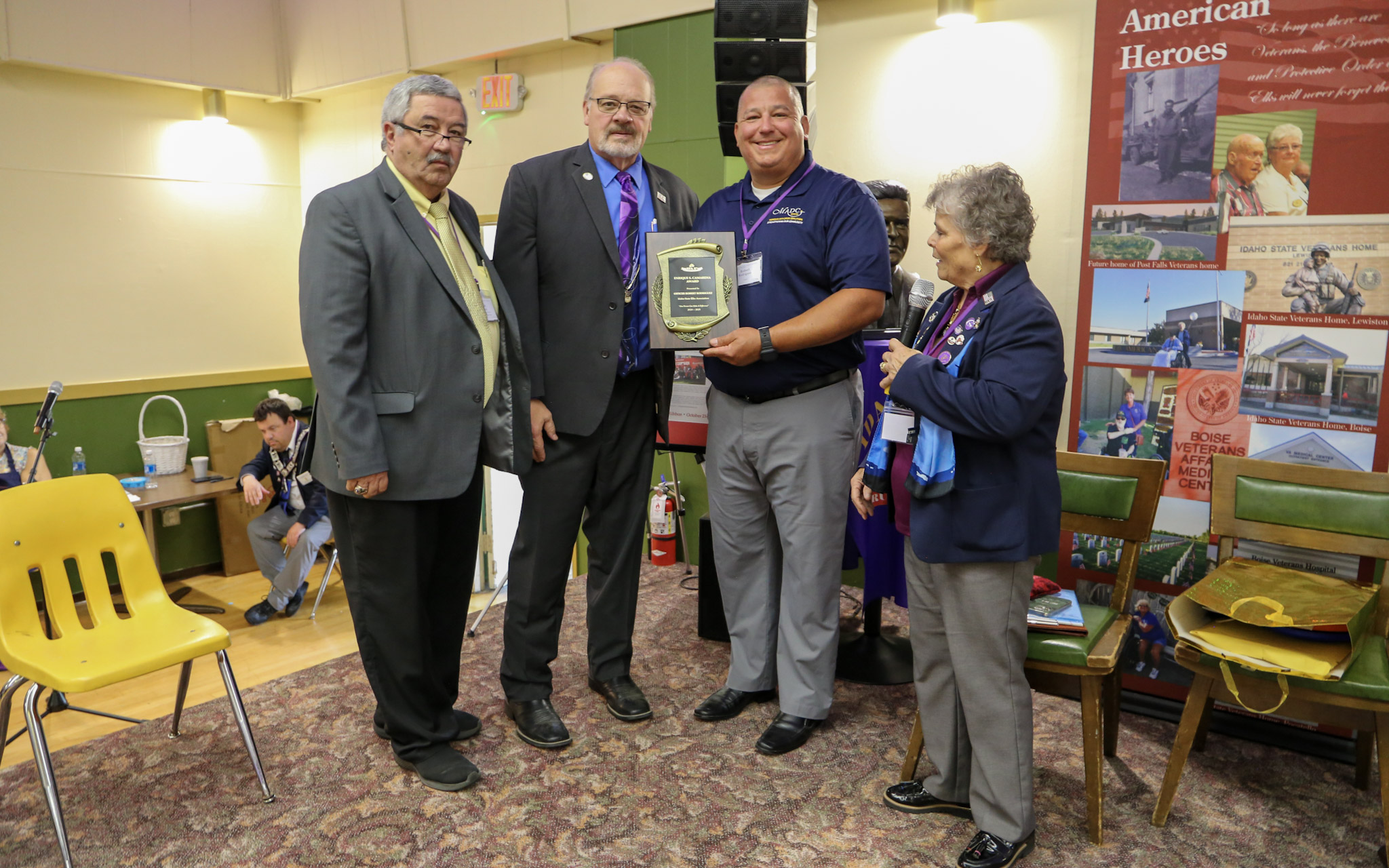 Robert Rodridriguez receives plaque for the Kiki Camarena Award from 3 member of the Order of the Elks Drug Awareness Commission