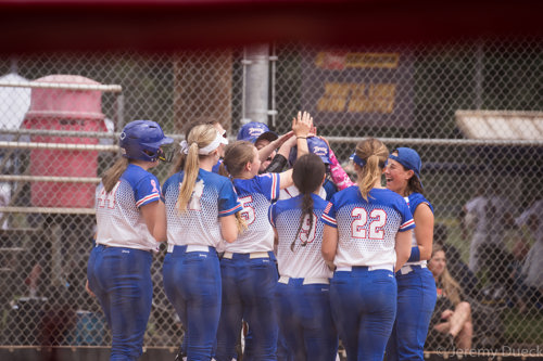 Girls Softball team high fiving after a win