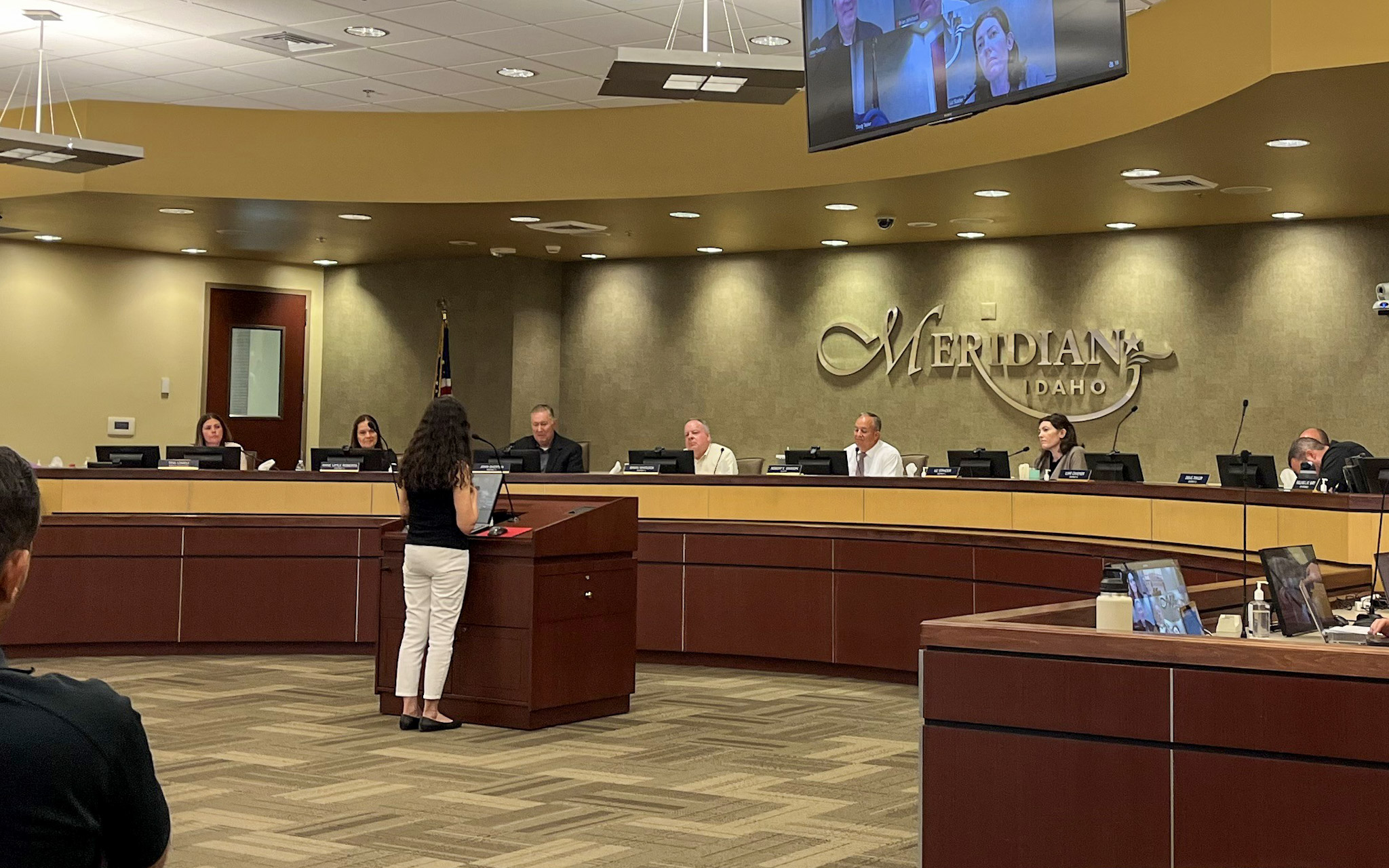 Resident speaks at City council meeting in front of Mayor and Council